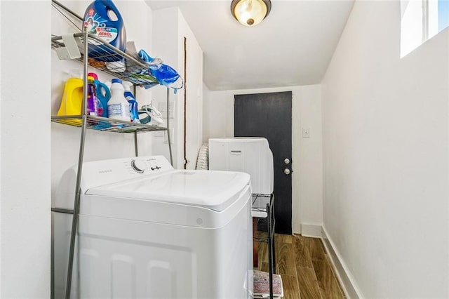 112830 N Roman St, New Orleans, LA 70116 - laundry area featuring washer / dryer and wood finished floors