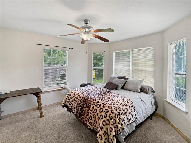 2411 Jay St, Slidell, LA 70460 - carpeted bedroom with baseboards and ceiling fan