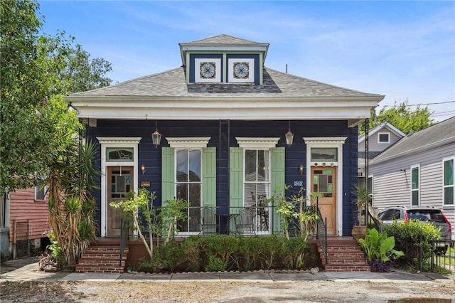 820-22 N Salcedo St, New Orleans, LA 70119 - view of front of property with covered porch and a shingled roof