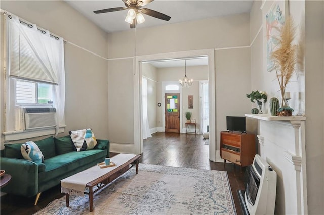 820-22 N Salcedo St, New Orleans, LA 70119 - living room with heating unit, dark wood-type flooring, ceiling fan, a chandelier, and cooling unit