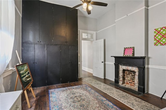 820-22 N Salcedo St, New Orleans, LA 70119 - bedroom with wood finished floors, a fireplace, and a ceiling fan