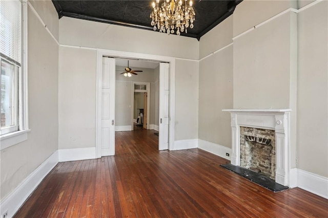 820-22 N Salcedo St, New Orleans, LA 70119 - unfurnished living room featuring hardwood / wood-style flooring, a chandelier, a fireplace with raised hearth, and a ceiling fan