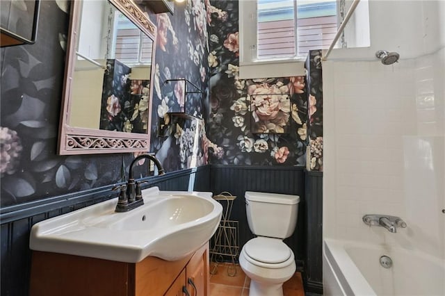 820-22 N Salcedo St, New Orleans, LA 70119 - bathroom featuring wallpapered walls, wainscoting, vanity, and washtub / shower combination