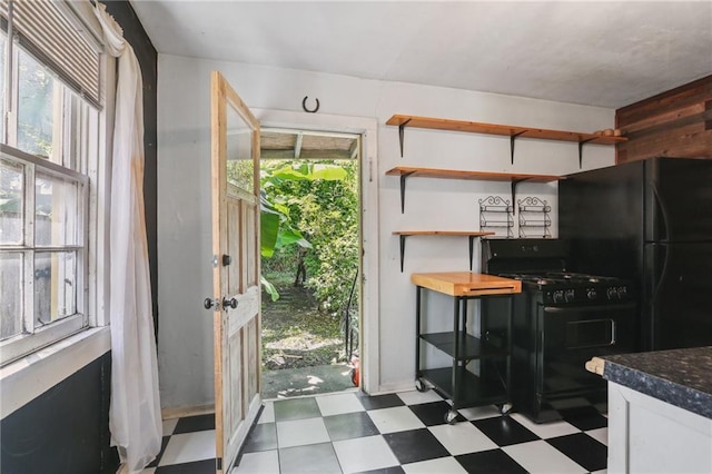 820-22 N Salcedo St, New Orleans, LA 70119 - kitchen featuring black appliances, tile patterned floors, plenty of natural light, and dark countertops