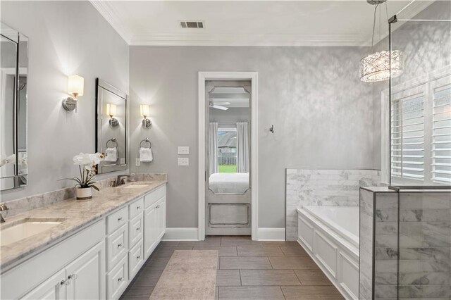 1104 Cypress Crossing Dr, Madisonville, LA 70447 - ensuite bathroom featuring a bath, double vanity, crown molding, and wood finish floors