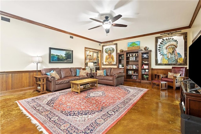 925 Winona Dr, Mandeville, LA 70471 - living area with concrete floors, a ceiling fan, a wainscoted wall, crown molding, and wood walls