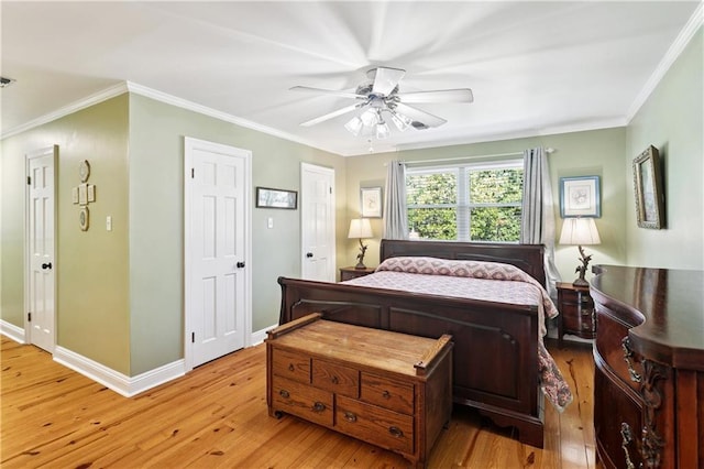 925 Winona Dr, Mandeville, LA 70471 - bedroom with light wood finished floors, ornamental molding, and a ceiling fan