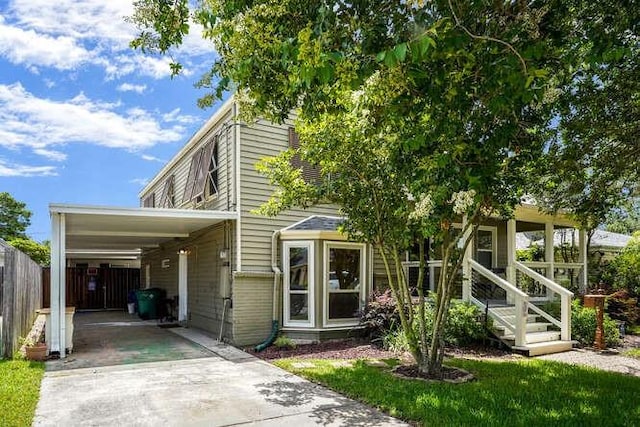 419 W William David Pkwy, Metairie, LA 70005 - view of front of property featuring driveway and an attached carport