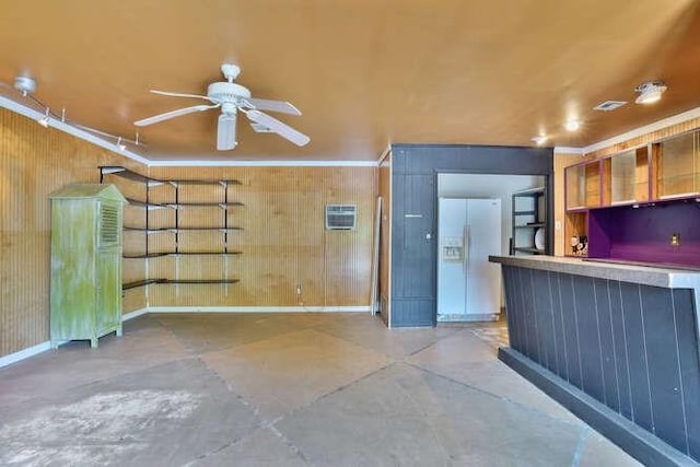 419 W William David Pkwy, Metairie, LA 70005 - kitchen with white refrigerator with ice dispenser, ornamental molding, ceiling fan, concrete flooring, and an AC wall unit