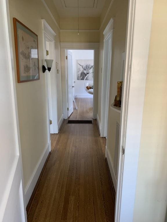 2527 Calhoun St, New Orleans, LA 70118 - hallway featuring attic access and wood finished floors