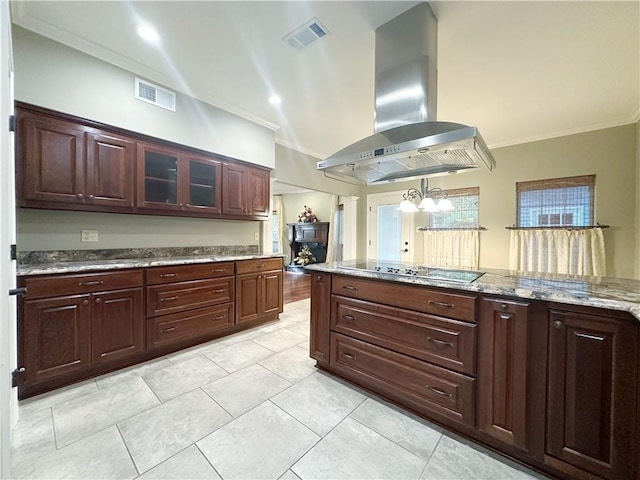 118 Golden Pheasant Dr, Slidell, LA 70461 - kitchen with wall chimney exhaust hood, black electric stovetop, crown molding, glass insert cabinets, and light stone counters