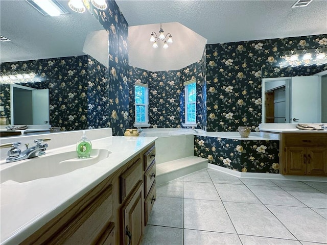 118 Golden Pheasant Dr, Slidell, LA 70461 - bathroom with wallpapered walls, a textured ceiling, a bath, vanity, and tile patterned floors
