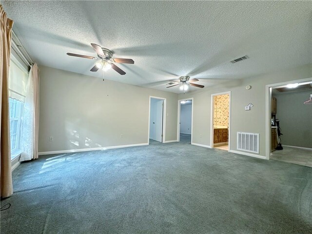 118 Golden Pheasant Dr, Slidell, LA 70461 - unfurnished bedroom featuring carpet flooring, a textured ceiling, a walk in closet, ceiling fan, and ensuite bathroom