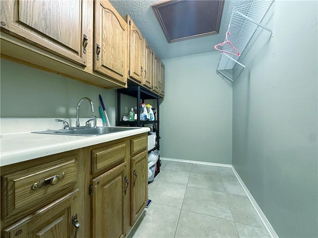 118 Golden Pheasant Dr, Slidell, LA 70461 - laundry area with a sink and light tile patterned floors