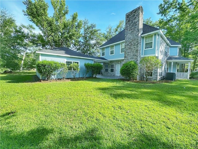 118 Golden Pheasant Dr, Slidell, LA 70461 - rear view of property featuring a yard, a chimney, and a porch