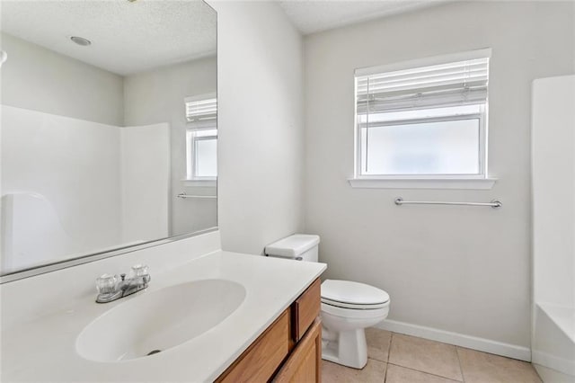 1420 W 20th Ave, Covington, LA 70433 - bathroom featuring vanity, tile patterned floors, and a textured ceiling