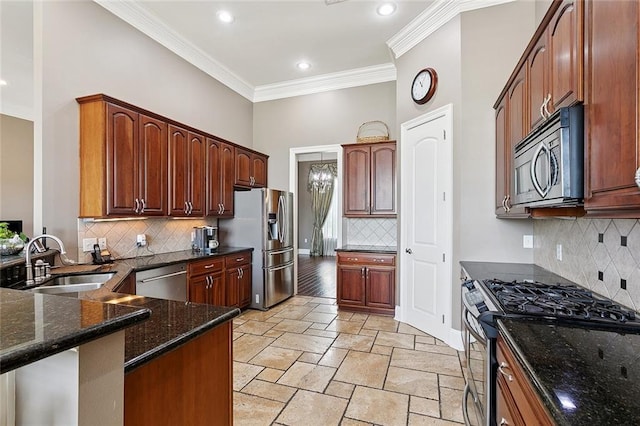 110 Lac Felicity Dr, Luling, LA 70070 - kitchen with appliances with stainless steel finishes, backsplash, crown molding, dark stone countertops, and stone tile flooring