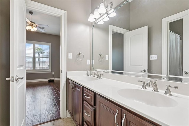 110 Lac Felicity Dr, Luling, LA 70070 - full bathroom featuring double vanity, wood finished floors, and a ceiling fan