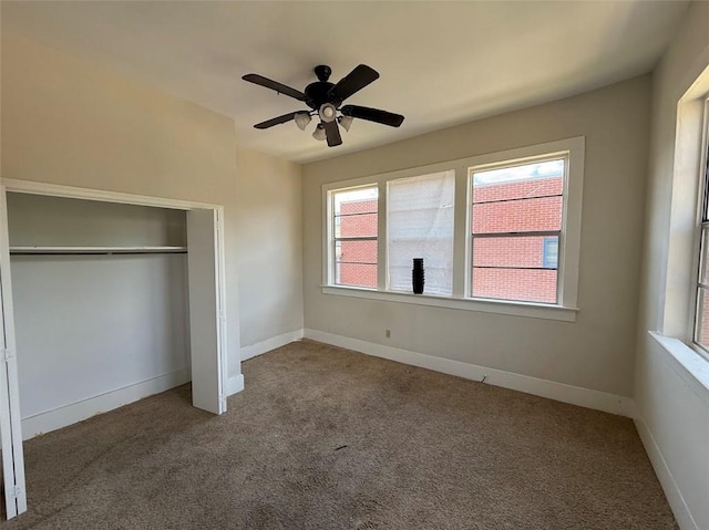 223335 Baronne St, New Orleans, LA 70113 - unfurnished bedroom with carpet flooring, a closet, and a ceiling fan