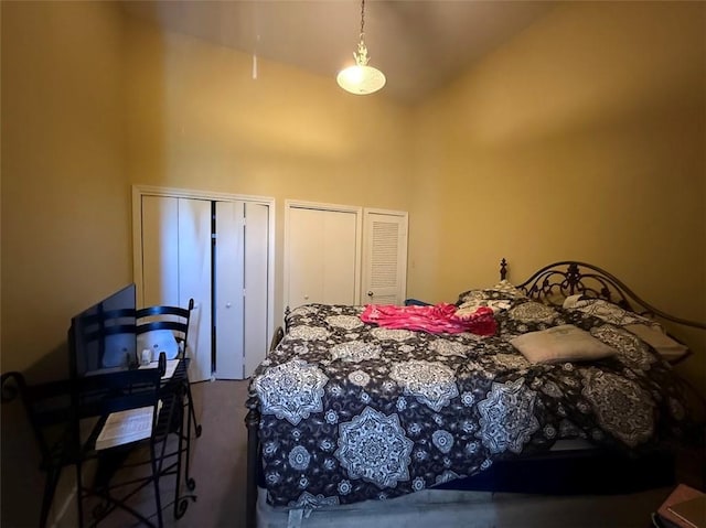 223335 Baronne St, New Orleans, LA 70113 - bedroom featuring high vaulted ceiling, two closets, and carpet flooring