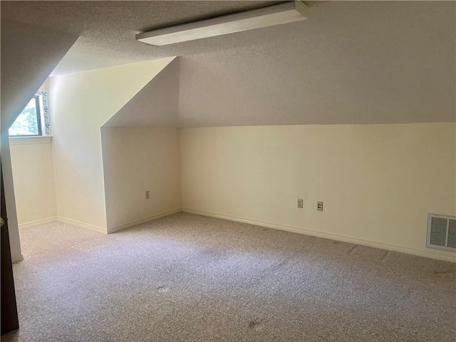 45156 Jenkins Rd 2 Rd, Franklinton, LA 70438 - bonus room with a textured ceiling, carpet floors, and vaulted ceiling