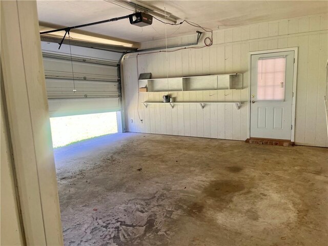 45156 Jenkins Rd 2 Rd, Franklinton, LA 70438 - garage with a garage door opener and wooden walls