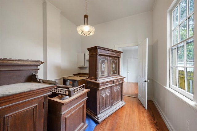 21921 Vallette St, New Orleans, LA 70114 - detailed view of wood finished floors, a wainscoted wall, and crown molding