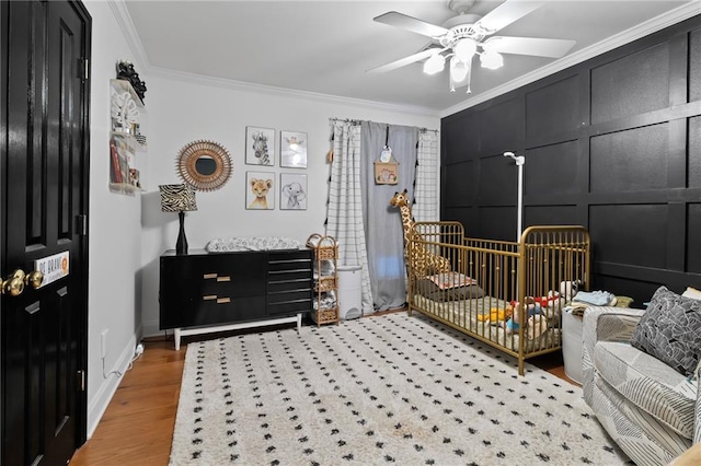 4301 Napoli Dr, Metairie, LA 70002 - bedroom with ornamental molding, light wood-style floors, and a ceiling fan