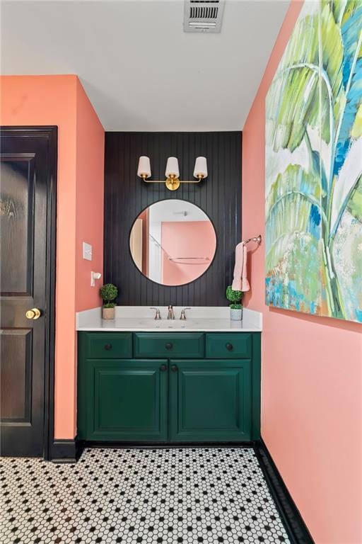4301 Napoli Dr, Metairie, LA 70002 - bathroom featuring an accent wall, vanity, and wooden walls