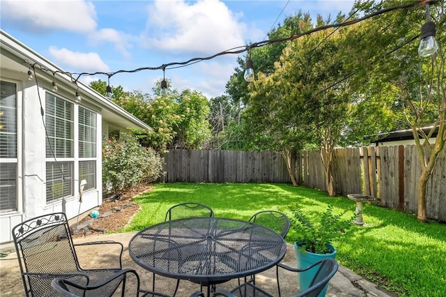 4301 Napoli Dr, Metairie, LA 70002 - fenced backyard with outdoor dining space and a patio area