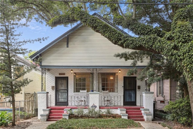 751618 Willow St, New Orleans, LA 70118 - view of front of property featuring covered porch and brick siding