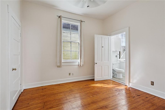 751618 Willow St, New Orleans, LA 70118 - unfurnished bedroom with wood finished floors, ensuite bath, and ceiling fan