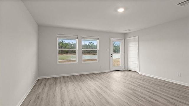 4674 Marais River Dr, Slidell, LA 70461 - empty room featuring wood finished floors and plenty of natural light