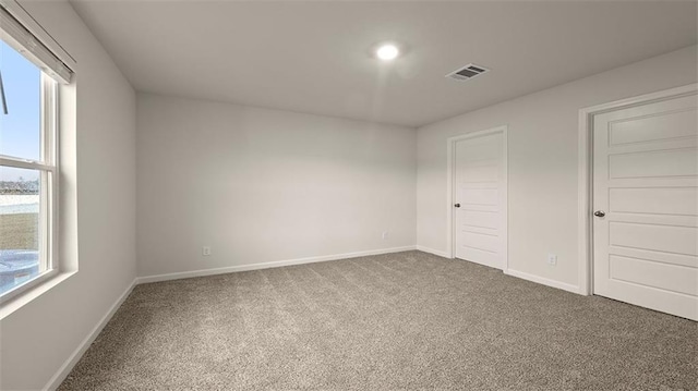 4674 Marais River Dr, Slidell, LA 70461 - unfurnished bedroom featuring multiple windows and carpet floors