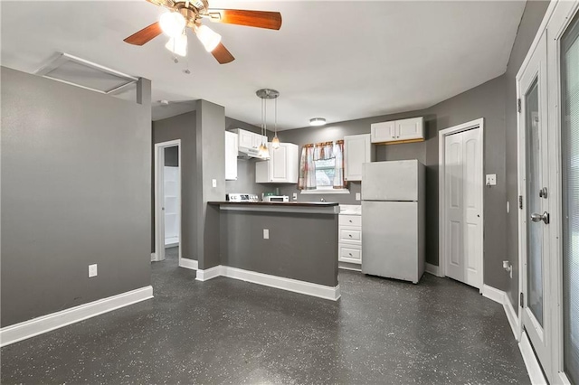 3309 Oak Dr, Violet, LA 70092 - kitchen with freestanding refrigerator, a peninsula, white cabinetry, ceiling fan, and under cabinet range hood