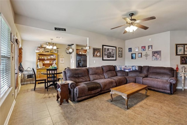 17126 Beacon St, Ponchatoula, LA 70454 - living area with light tile patterned flooring, a ceiling fan, and a chandelier