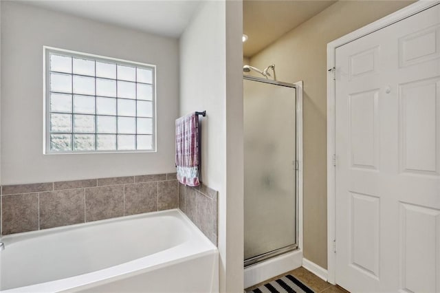 17126 Beacon St, Ponchatoula, LA 70454 - bathroom with a shower stall, a garden tub, healthy amount of natural light, and tile patterned floors