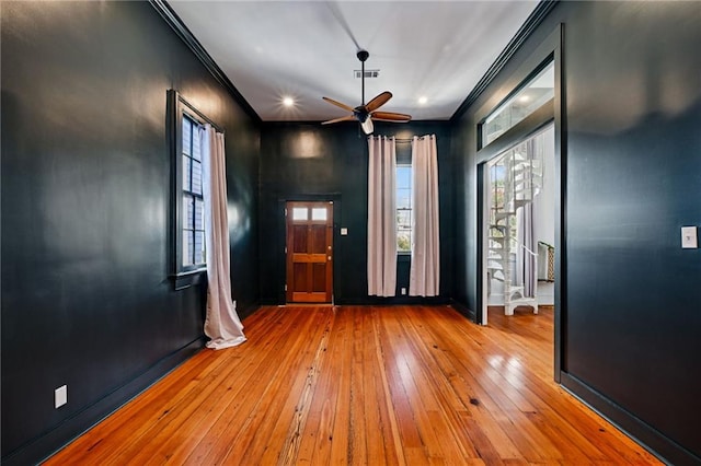 332 Olivier St, New Orleans, LA 70114 - spare room featuring hardwood / wood-style flooring, ornamental molding, a ceiling fan, and recessed lighting