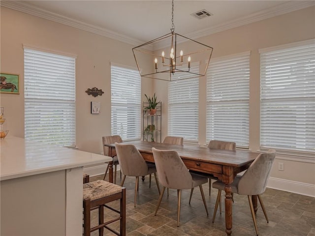 242 Douglas Dr, New Orleans, LA 70123 - dining area with a chandelier, stone finish flooring, and crown molding