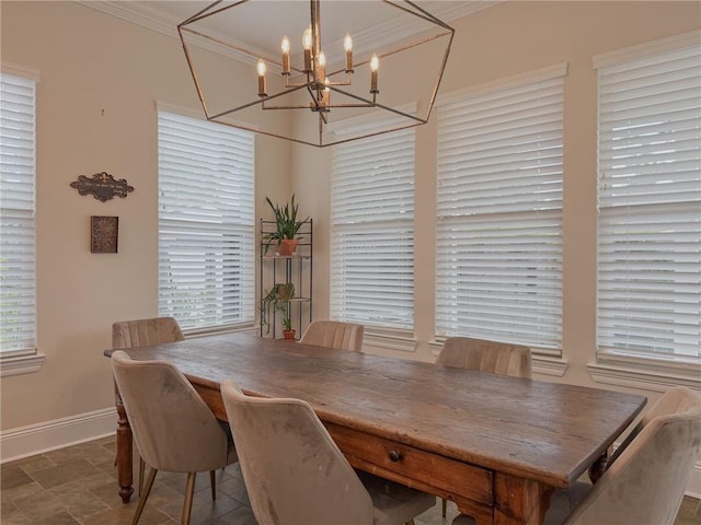 242 Douglas Dr, New Orleans, LA 70123 - dining space with a chandelier, stone finish flooring, and crown molding