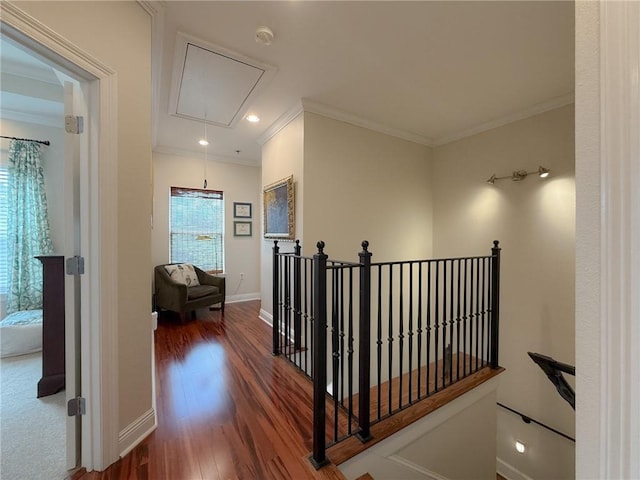 242 Douglas Dr, New Orleans, LA 70123 - hallway featuring attic access, ornamental molding, an upstairs landing, wood finished floors, and recessed lighting