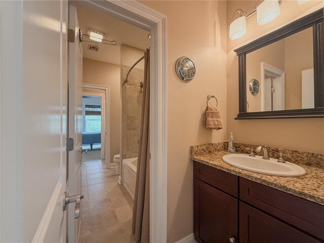 242 Douglas Dr, New Orleans, LA 70123 - bathroom featuring vanity, shower / bath combination with curtain, and tile patterned flooring