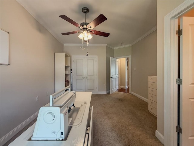 242 Douglas Dr, New Orleans, LA 70123 - unfurnished bedroom with crown molding, carpet floors, a closet, and a ceiling fan