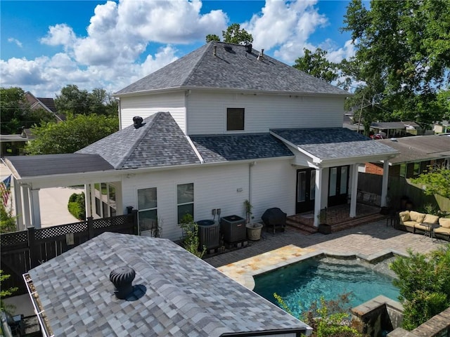 242 Douglas Dr, New Orleans, LA 70123 - rear view of property featuring a shingled roof, a fenced backyard, and a patio