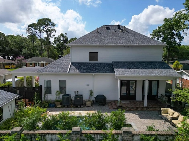 242 Douglas Dr, New Orleans, LA 70123 - rear view of property featuring a patio area and roof with shingles