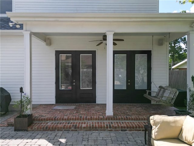 242 Douglas Dr, New Orleans, LA 70123 - property entrance featuring french doors and ceiling fan