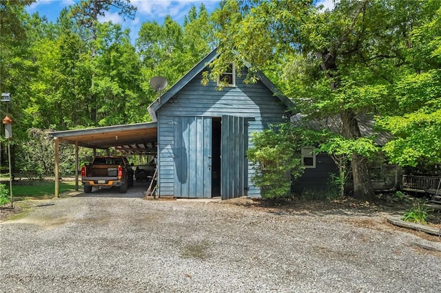 81011 Bob Baxter Rd, Bush, LA 70431 - view of outbuilding featuring gravel driveway and a carport
