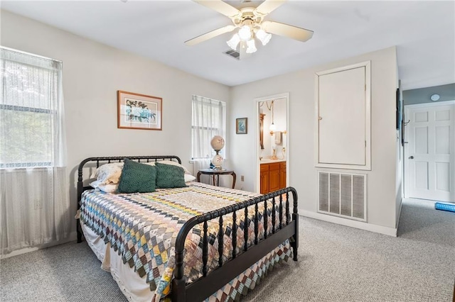 81011 Bob Baxter Rd, Bush, LA 70431 - bedroom with light colored carpet, ceiling fan, and connected bathroom