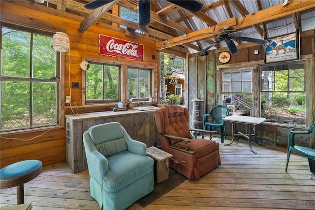 81011 Bob Baxter Rd, Bush, LA 70431 - sunroom / solarium with ceiling fan, wooden walls, and hardwood / wood-style floors