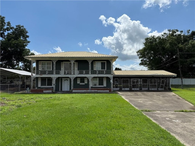 652 Central Ave, Reserve, LA 70084 - view of front of home featuring a balcony, covered porch, a metal roof, and driveway